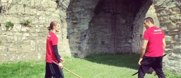 Nathan and Highlanders Adrian paul performing fight choriography at Trim castle..jpg