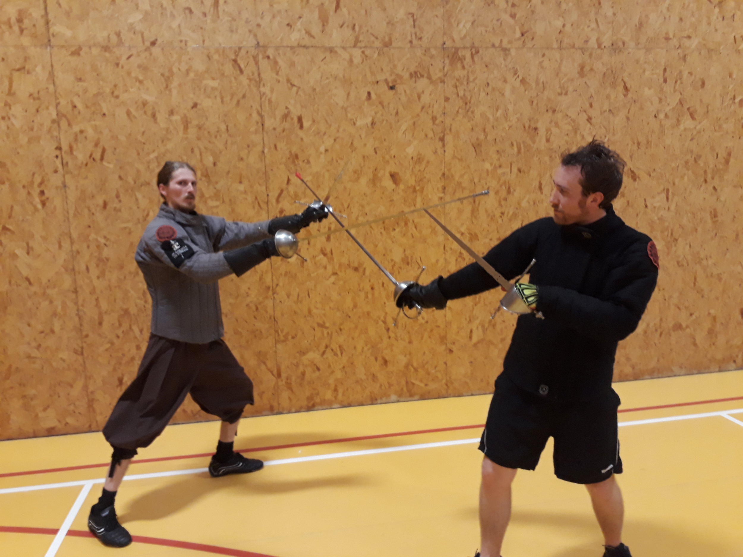 Picture D stepping diagonally to the left (transvers step) and striking the opponent with the point while controling the opponents sword with the dagger..jpg