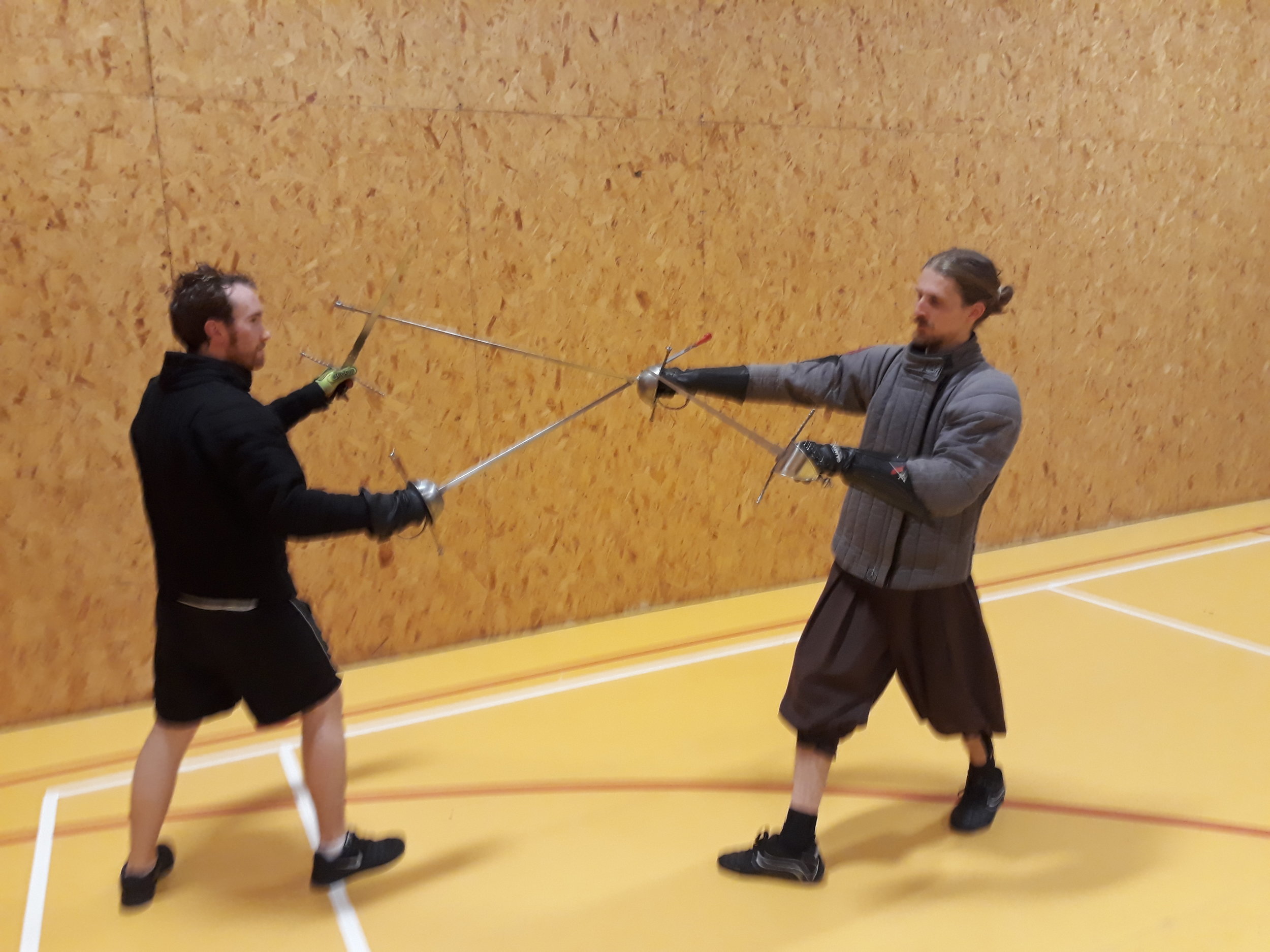 Picture G stepping a diagonal stransvers step to the right with the right leg and thrusting with the sword..jpg