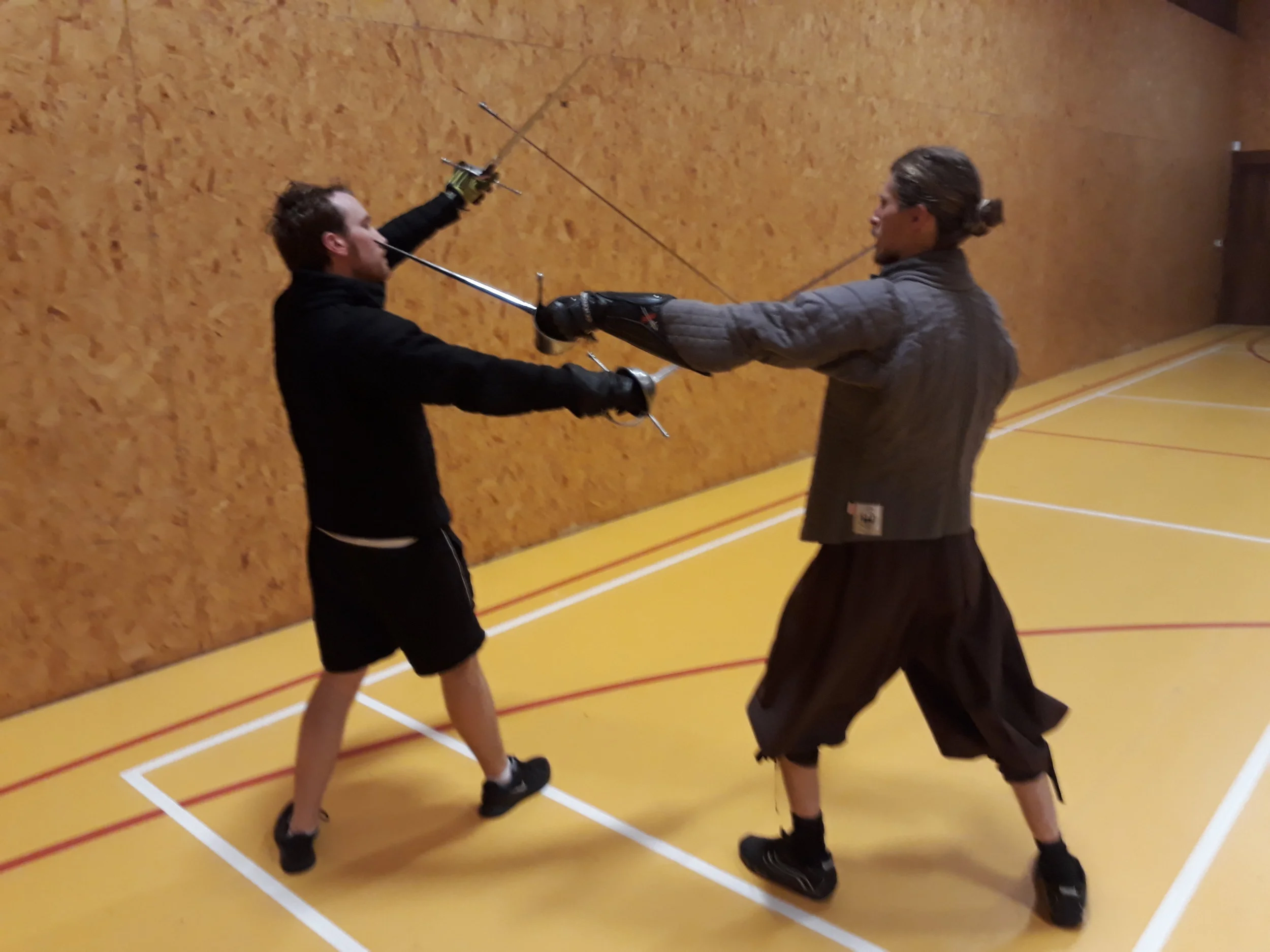Picture H perform a curved step (circular step) with your left leg brining your dagger in and thrusting to the face or chest,underarm of the opponent..jpg