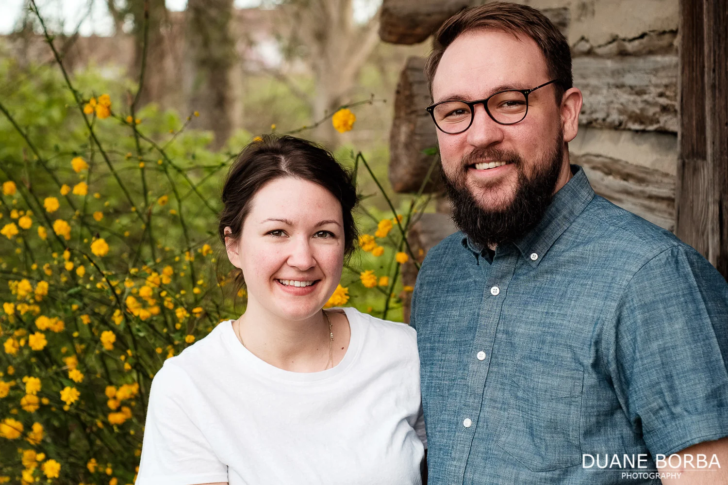 Couple portrait near yellow flowers