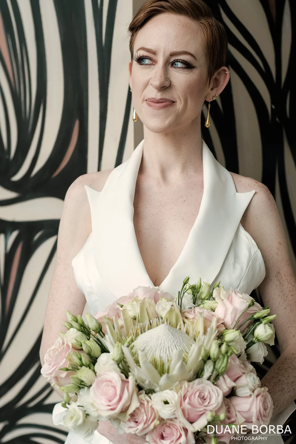 Bride posing with her bouquet