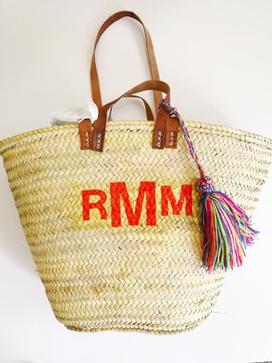 Monogram straw clutch with tassels — COLORES COLLECTIVE