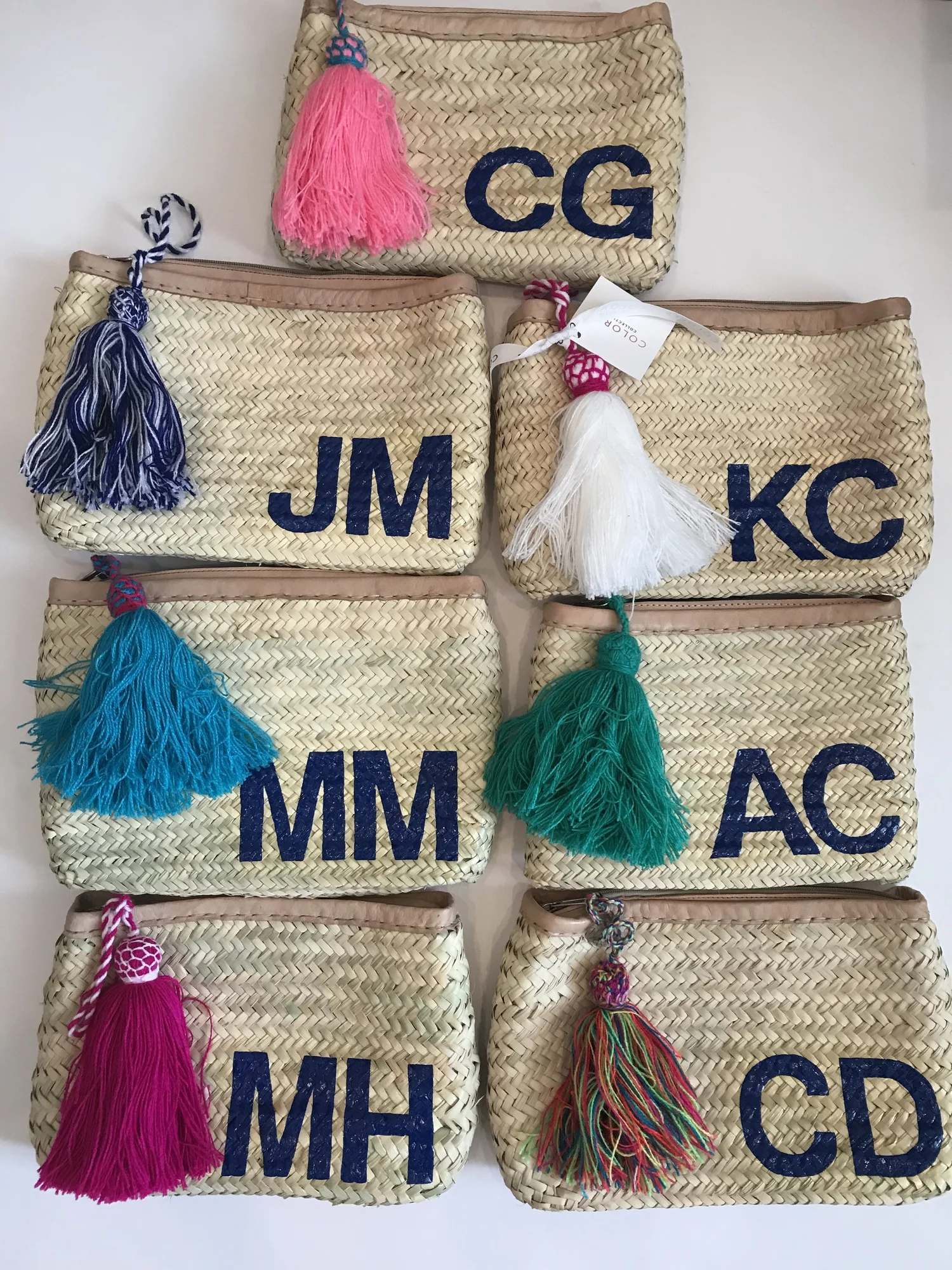 Monogram straw clutch with tassels — COLORES COLLECTIVE