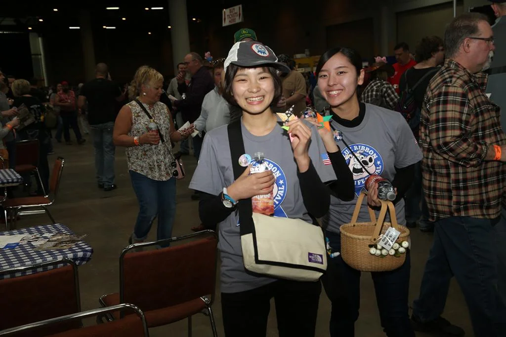 Guests from the Bacon Delegation enjoy the Blue Ribbon Bacon Festival in 2017.