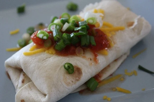 Mary Lovstad transformed one rotisserie chicken into four amazing meals, including a chicken enchilada dish. 