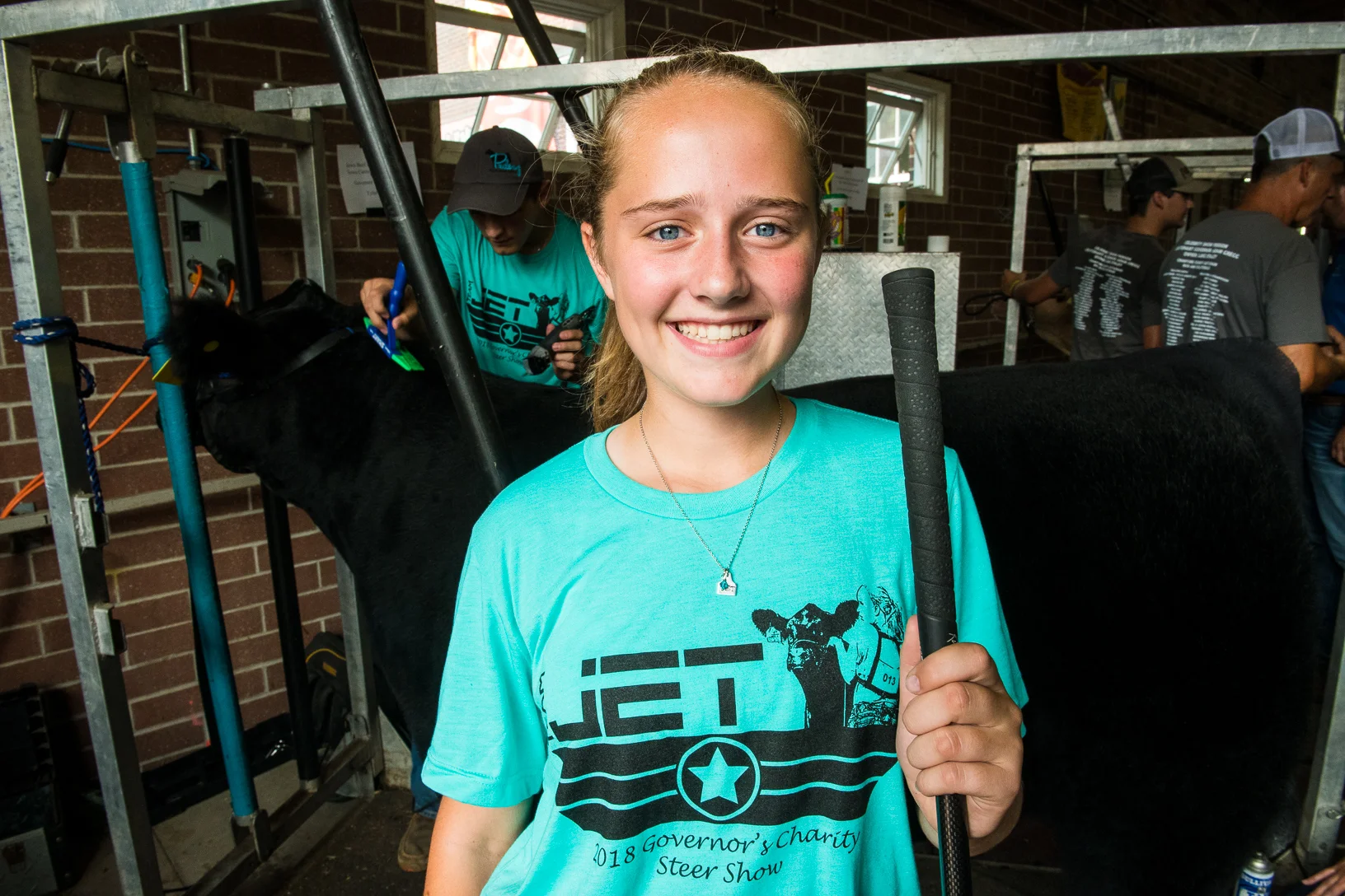 Tyler Pudenz pauses for a photo before meeting with Governor Kim Reynolds during the Governor's Charity Steer Show. Pudenz raised money from more than 32 sponsors to help the Ronald McDonald House. Photo credit: Joseph L. Murphy/Iowa Soybean Association