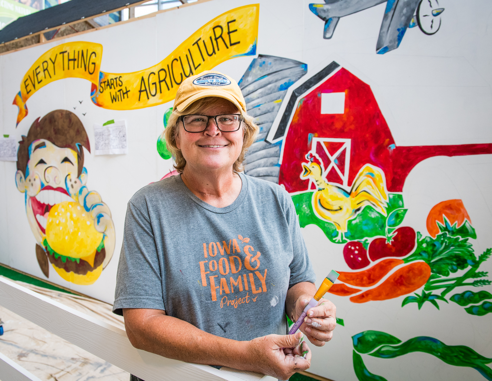 Cate Newberg, marketing director at the Iowa Soybean Association, painted a ‘Everything Starts with Agriculture’ mural throughout the fair. Photo credit: Joseph L. Murphy/Iowa Soybean Association