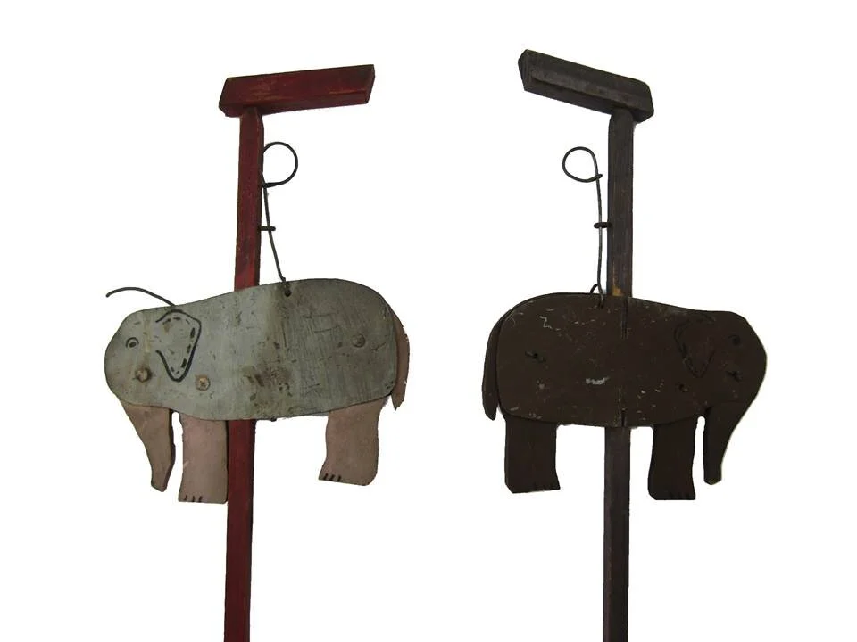 Elephants on poles back.jpg