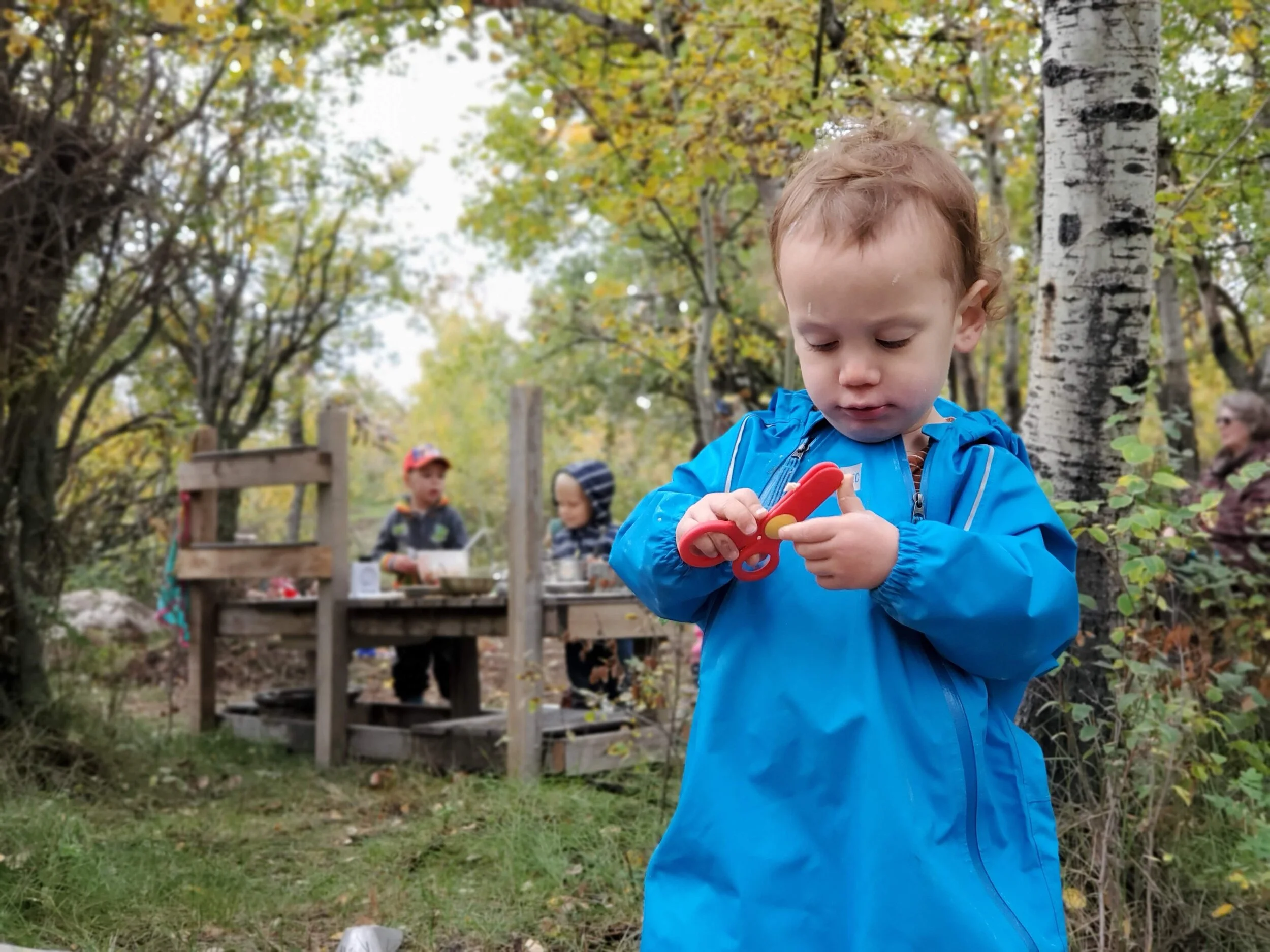 And although, to be honest, it could have JUST been a kitchen because the kids were SO into it, there were other stations set up including a place to play with dough which Paris experimented with a little. Okay, he just came to hunt for tools to take back to the kitchen.
