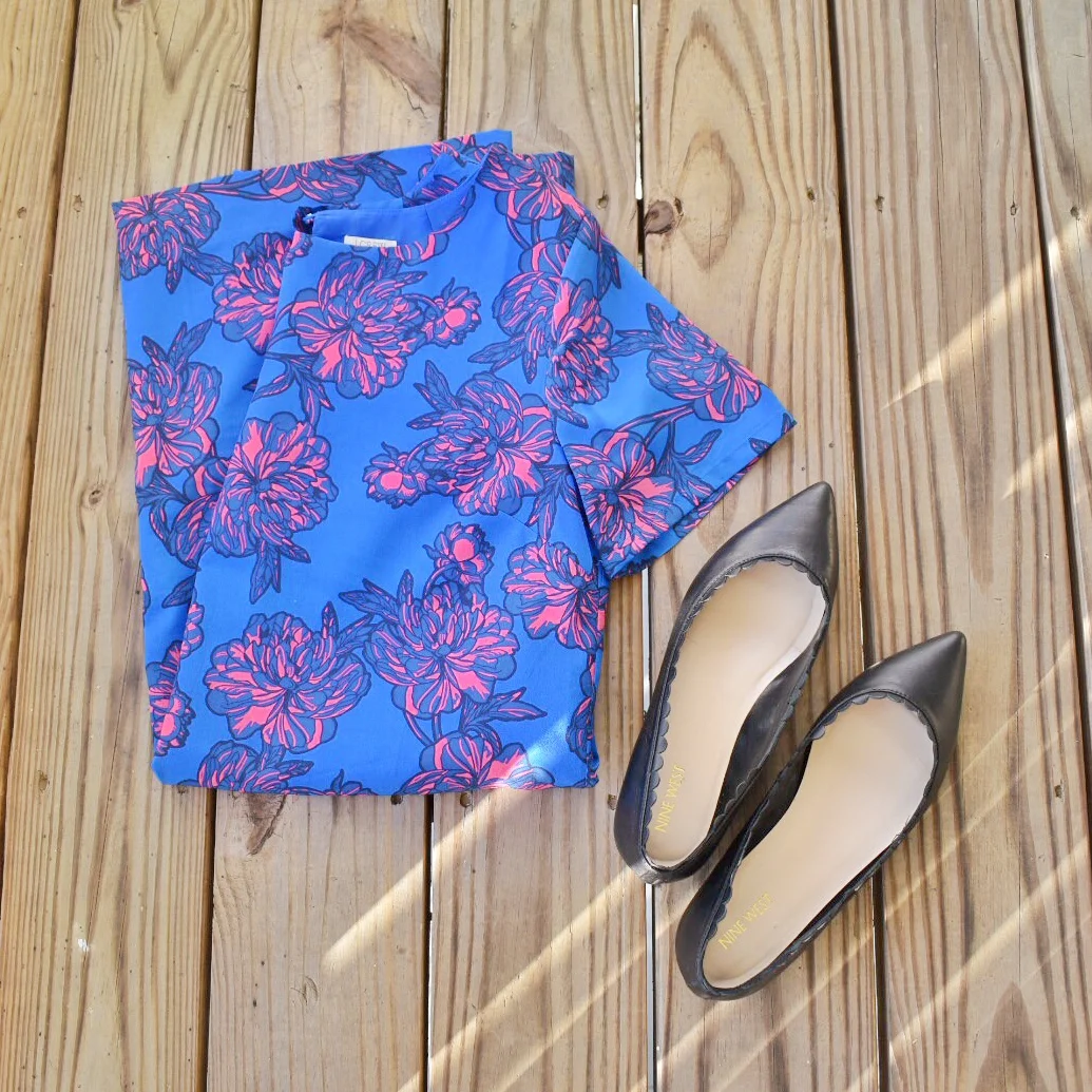 A pink and royal blue floral J.Crew brand shift dress with a pair of black Nine West brand shoes.