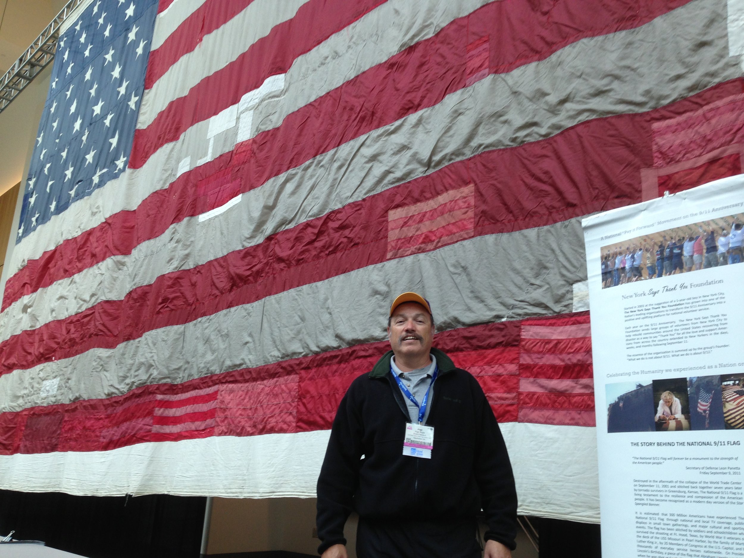 Tony with the 9/11 Memorial flag in New York City