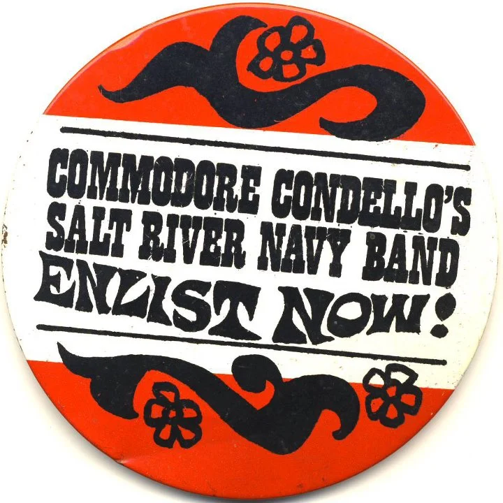 A button for Mike Condello's parody band that I got at the Fox Christown Theater in Phoenix in 1967, where I used to meet my friend Sara Ben-Shalom for Saturday morning movies and a stage show by Wallace & Ladmo, Pat McMahon, and Condello https://www.youtube.com/watch?v=tdYQZrJTszo.