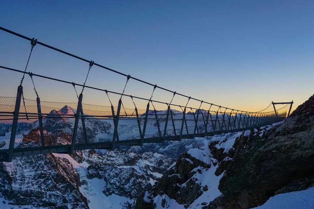 Suspension bridge on Mt Titlis overlooking the Alps