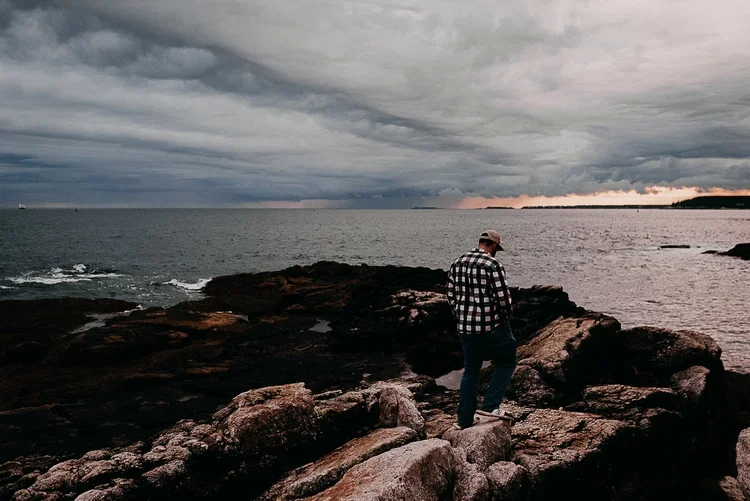 Acadia National Park elopement photographed by a Maine elopement photographer with expertise in coastal weddings, national park permits, and intimate ceremonies
Downeast Maine elopement photography capturing a couple getting married along the rocky c