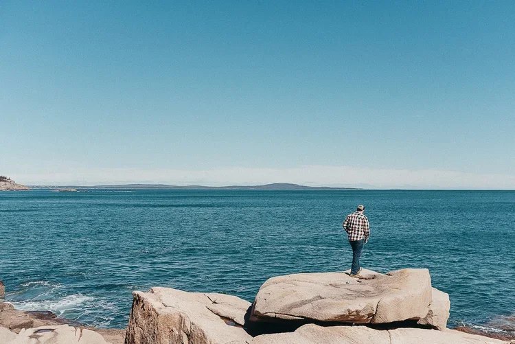 Acadia National Park elopement photographed by a Maine elopement photographer with expertise in coastal weddings, national park permits, and intimate ceremonies
Downeast Maine elopement photography capturing a couple getting married along the rocky c