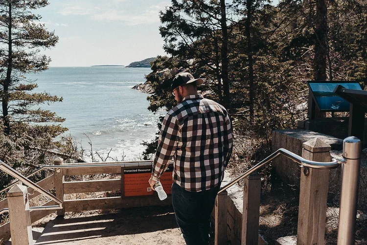 Acadia National Park elopement photographed by a Maine elopement photographer with expertise in coastal weddings, national park permits, and intimate ceremonies
Downeast Maine elopement photography capturing a couple getting married along the rocky c