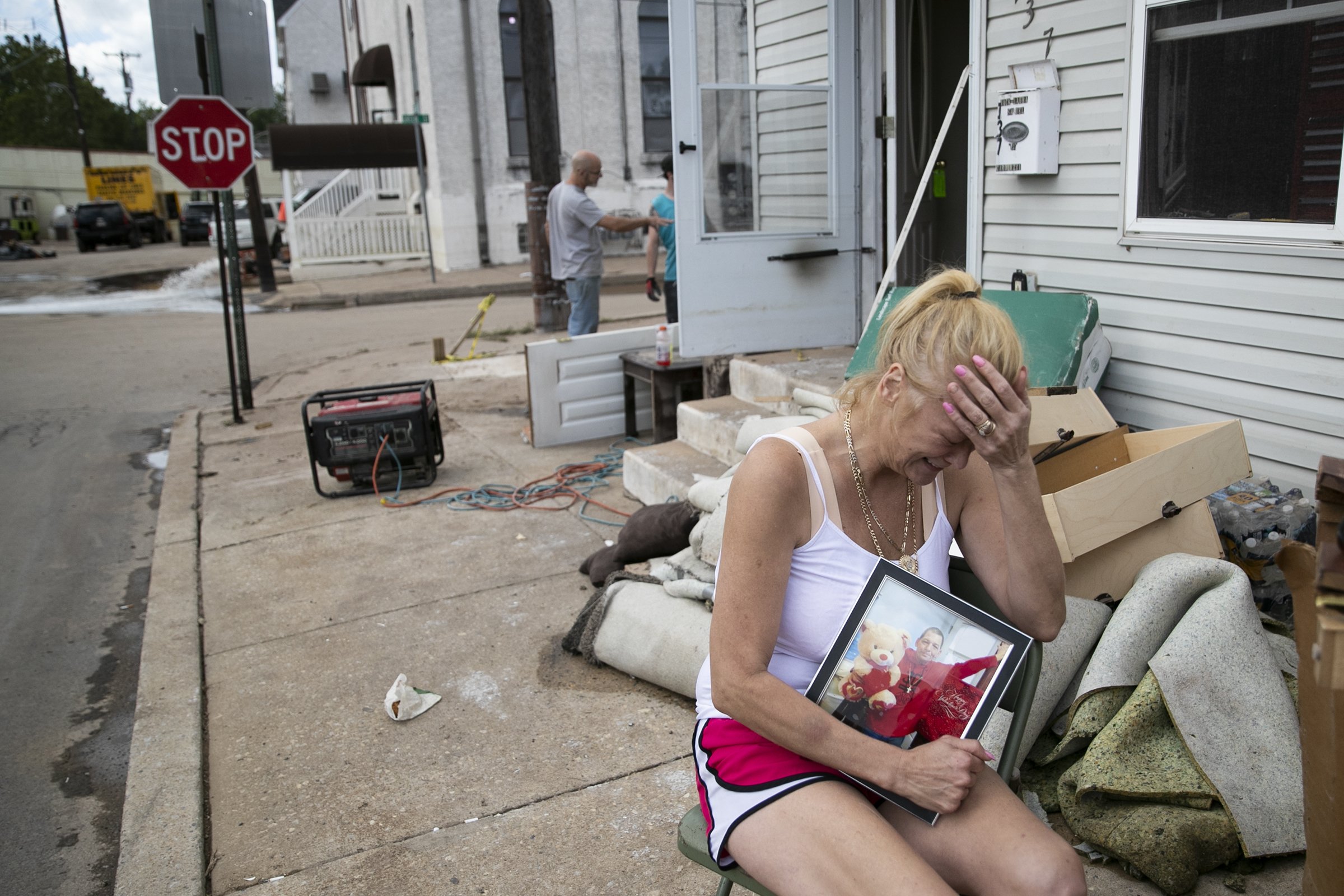  Laura Sinnott Caroluzzi tears up while she holds a photo of her husband, Jack Caroluzzi, who died in the flooding brought by the aftermath of Hurrican Ida, outside of their home in Bridgeport, Pa. on Sept. 3, 2021. Caroluzzi said they had been marri