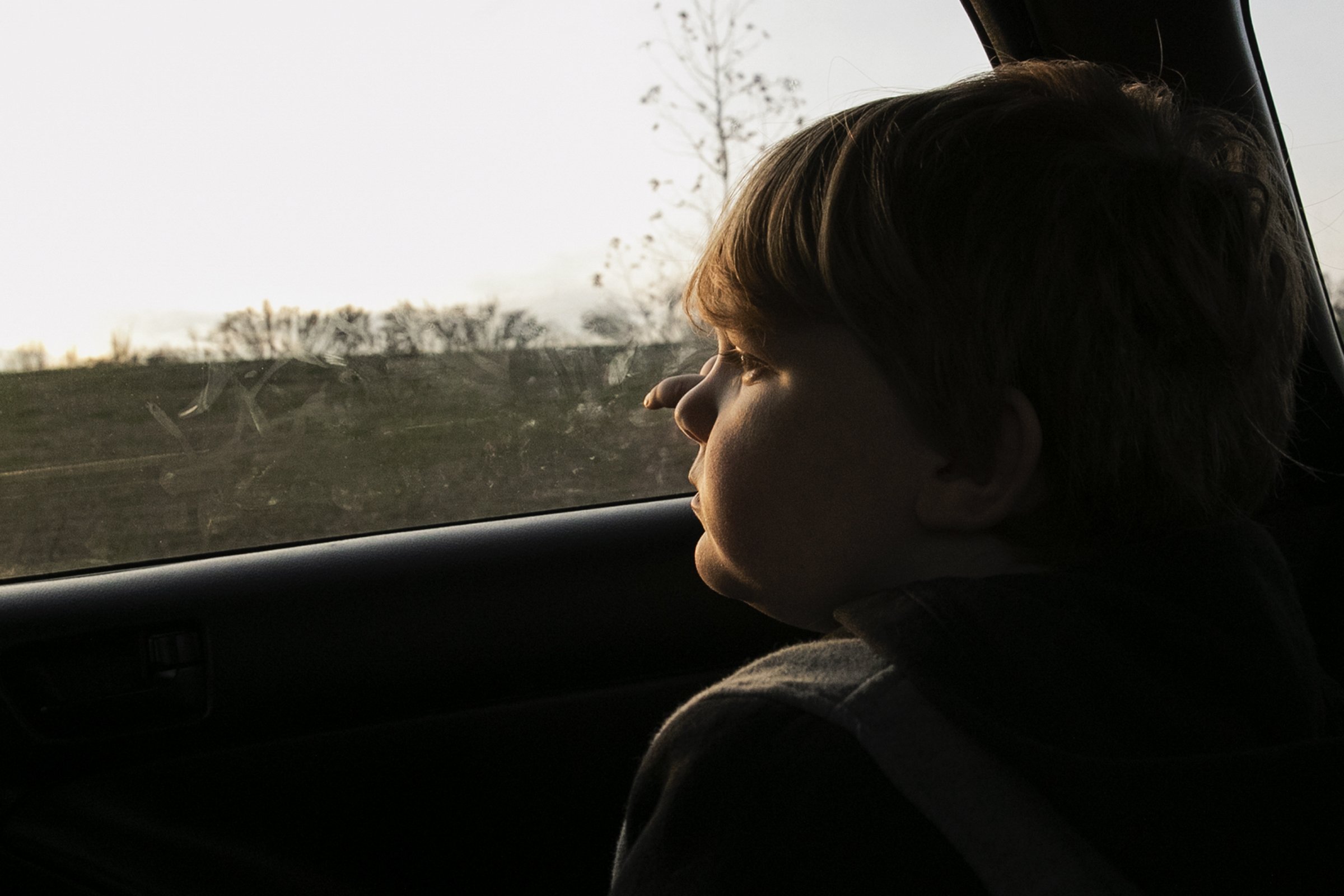  J.J. Borgesi, 12, looks out of the car window as he and his mom take their daily afternoon drive to look for housing around the Bridgeport, Pa. area on Dec. 1, 2021.  Amy Hylenski and her son were displaced after the flooding from Ida. They are curr