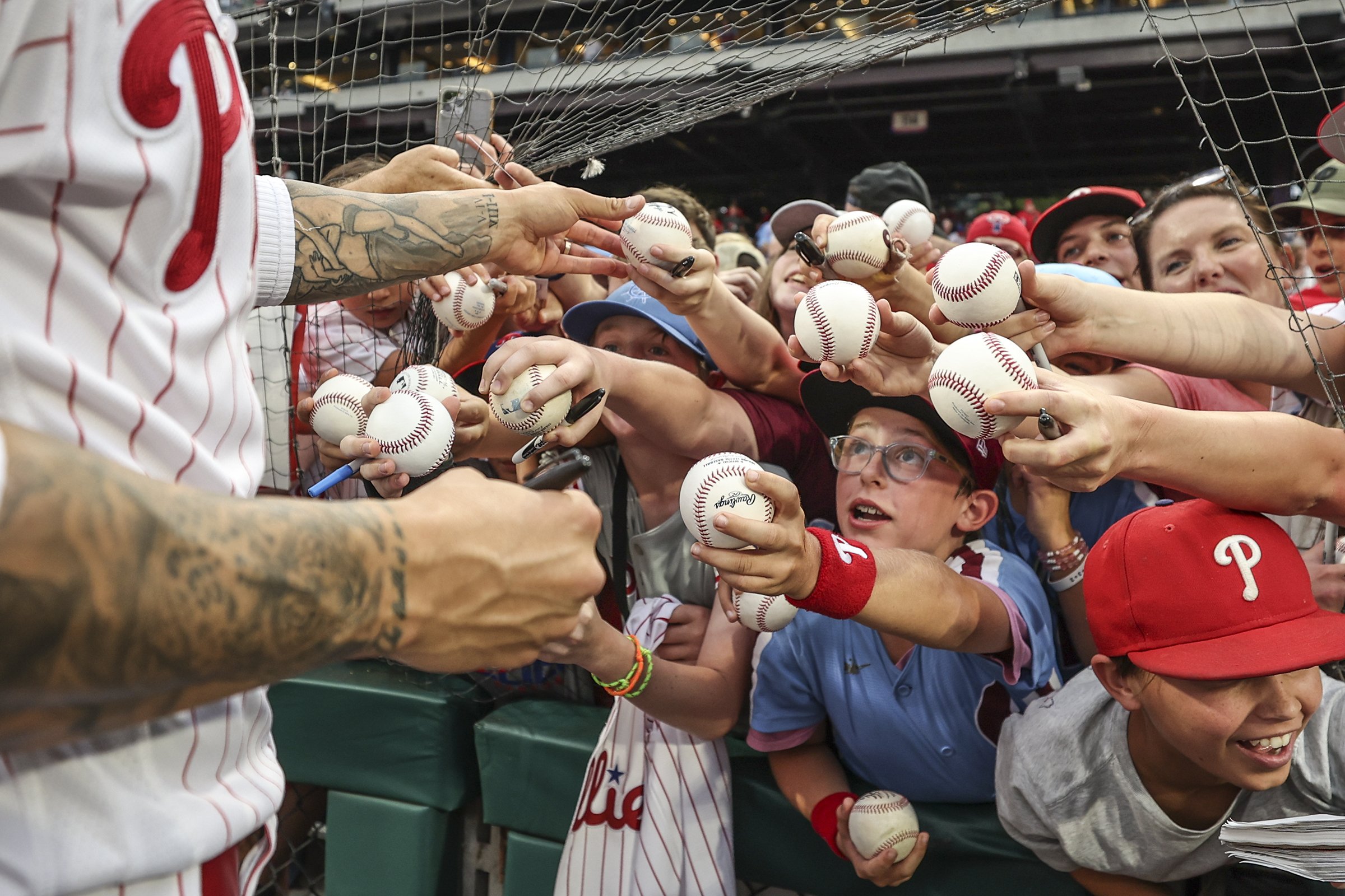  Fans clamor for an autograph from Philadelphia Phillies right fielder Nick Castellanos before the start of a game against the Los Angeles Angels at Citizens Bank Park in Philadelphia on Aug. 29, 2023. 