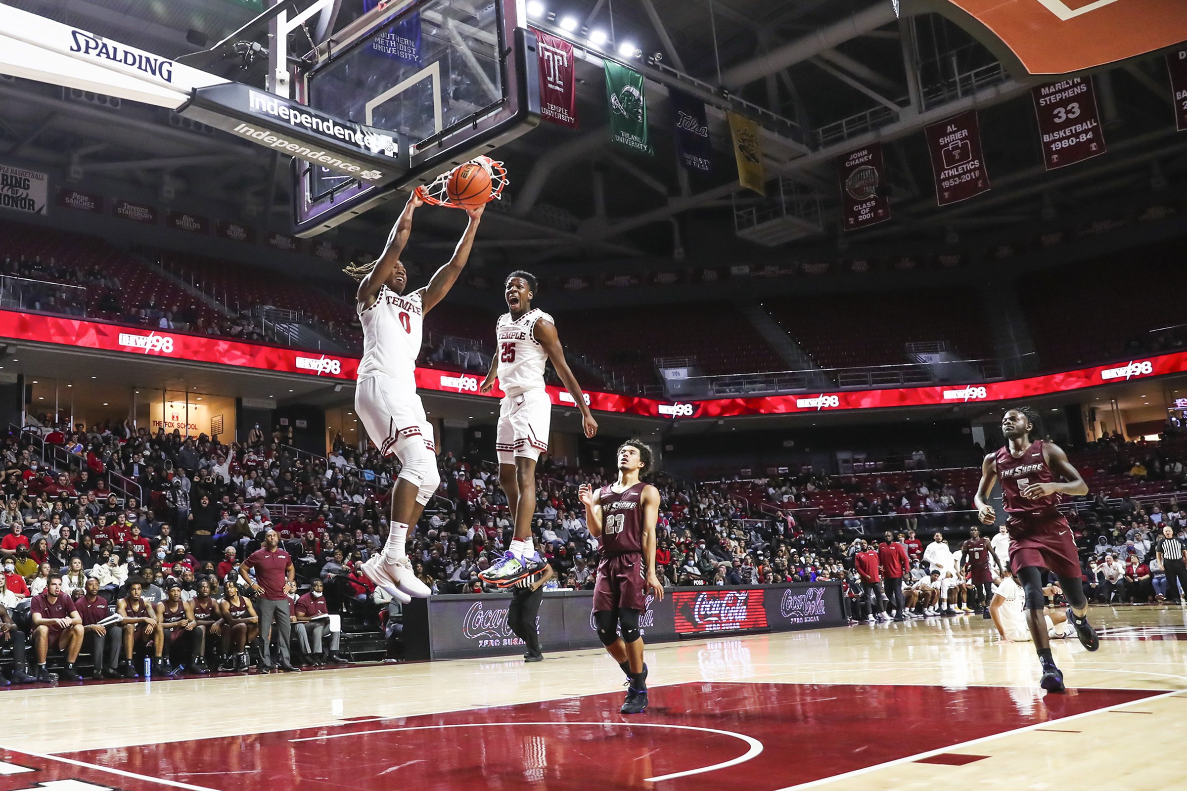  Temple guard Jeremiah Williams (25) celebrates as teammate Khalif Battle (0) dunks the ball off a steal in the first half of a game against the Maryland Eastern Shore Hawks at the Liacouras Center in Philadelphia on Nov. 10, 2021. 