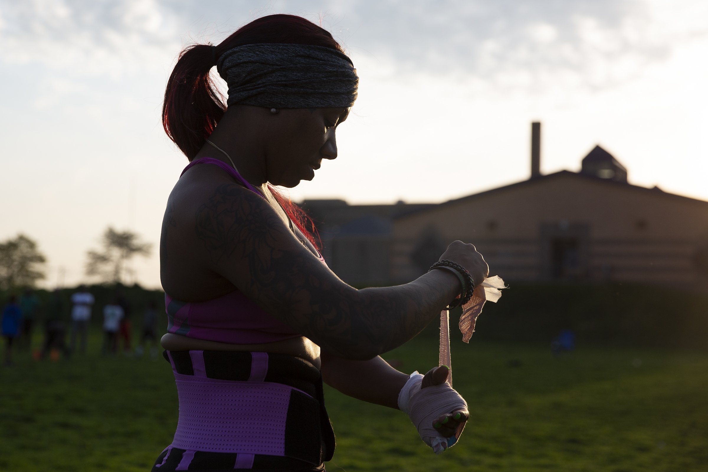  Star Wright, owner and player on the Philadelphia Phantomz, a tackle women’s football team, tapes up her wrist before practice in North Philly on April 18, 2019 