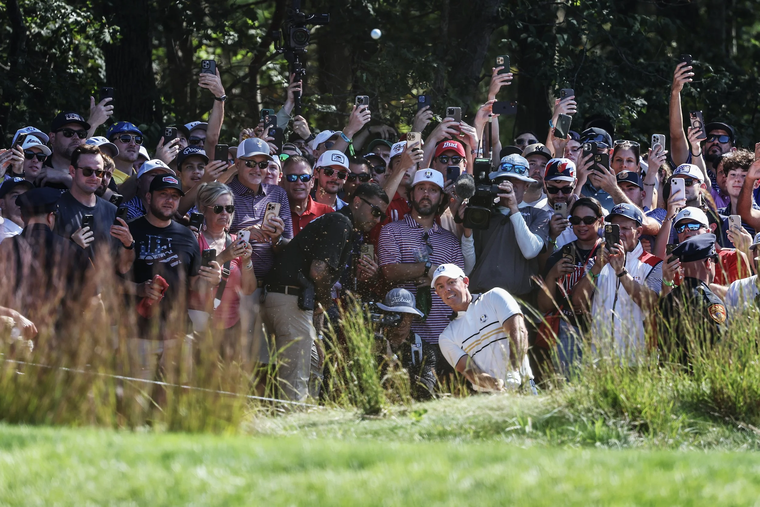  Rory McIlroy hits a shot on the 7th hole during his singles match against Scottie Scheffler in the Ryder Cup at Bethpage Black Golf Course in Farmingdale, N.Y. on Sunday, Sept. 28, 2025. 