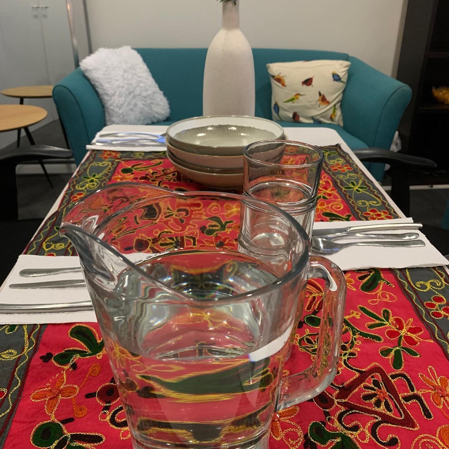 A picture of a family meal set up at our work place tonight to support Family Based Therapy for adolescents with Anorexia.  One of our colleagues set this up in our offices with a borrowed camping table, office chairs, mismatched cutlery, flowers fro