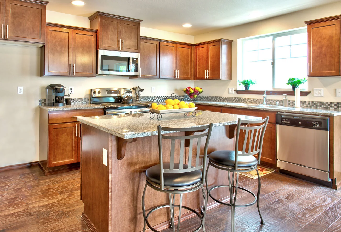 This kitchen in our model home at TRIO features one of the three standard finishes included with every home offered in our Cottages collection.