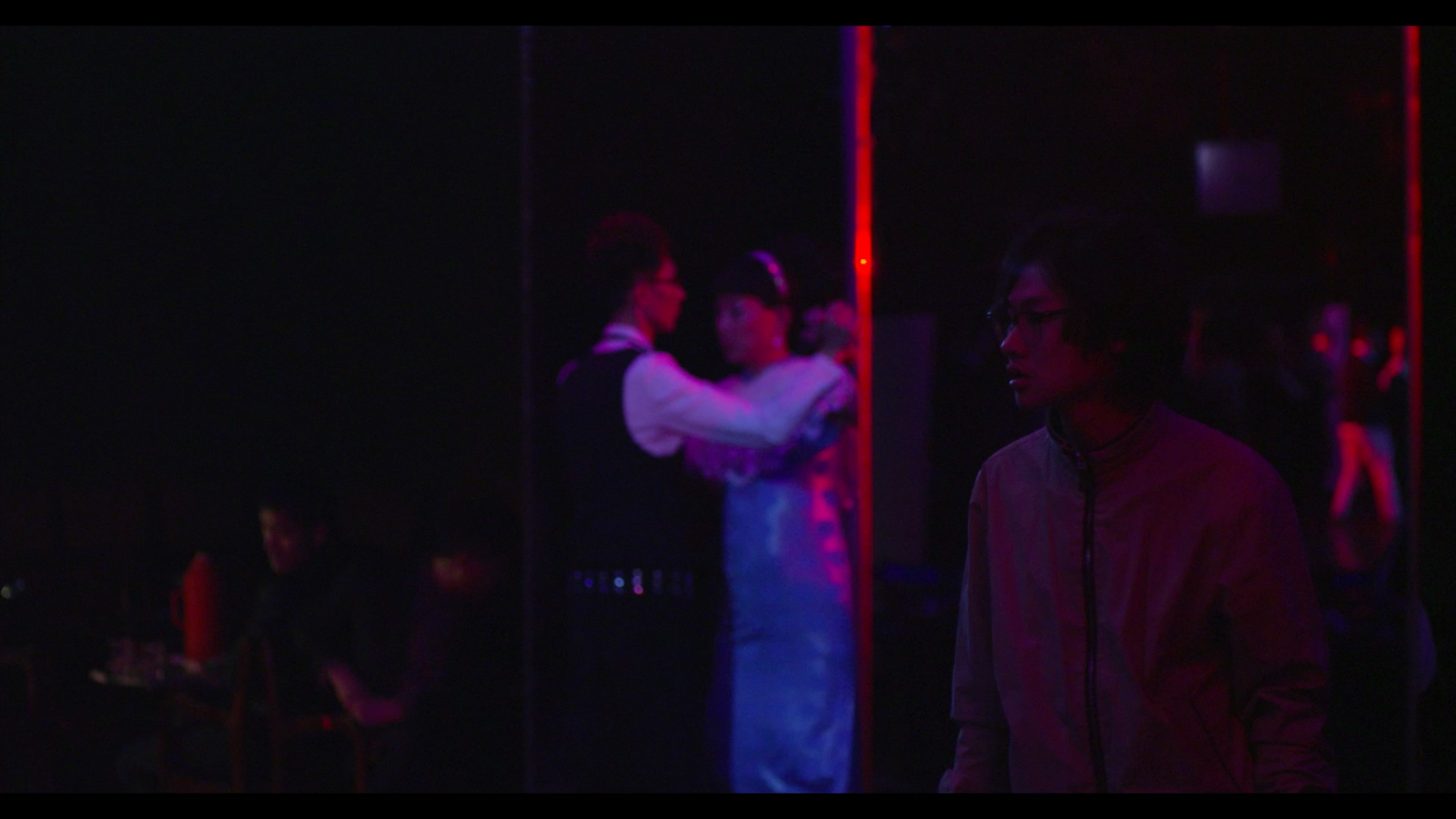 Blooming Night Director/ Writer/Producer: Bell Zhong // Producer: Sol Ye // China Bell is a lonely, twenty-something guy living in Shanghai. One day, wandering around in a run-down underpath, he sees a pair of bright red heels passing by. The color stimulates something deep in his heart. Out of curiosity, he follows its owner across the city and ends up in an old club where he discovers a forbidden community and realizes his hidden desires. 
