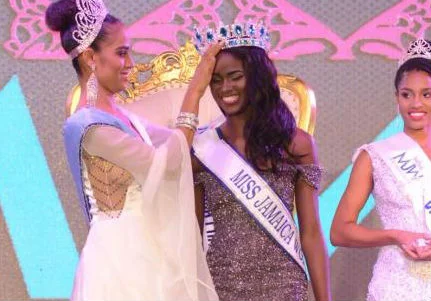 Miss Jamaica World, a top 10 in Miss World and Miss World Caribbean 2017, Solange Sinclair crowned the 2018 queen Khadijah Robinson. At right is the second runner-up, Catherine Harris - Shorn Hector photo (The Gleaner)