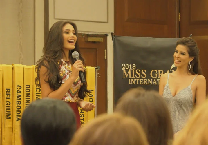 A happy Miss Venezuela introduces herself during the sash ceremony.