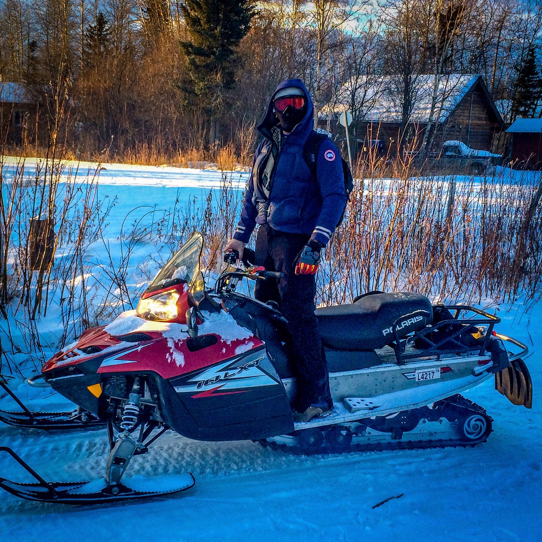 YukonMenSnowmobile.jpeg