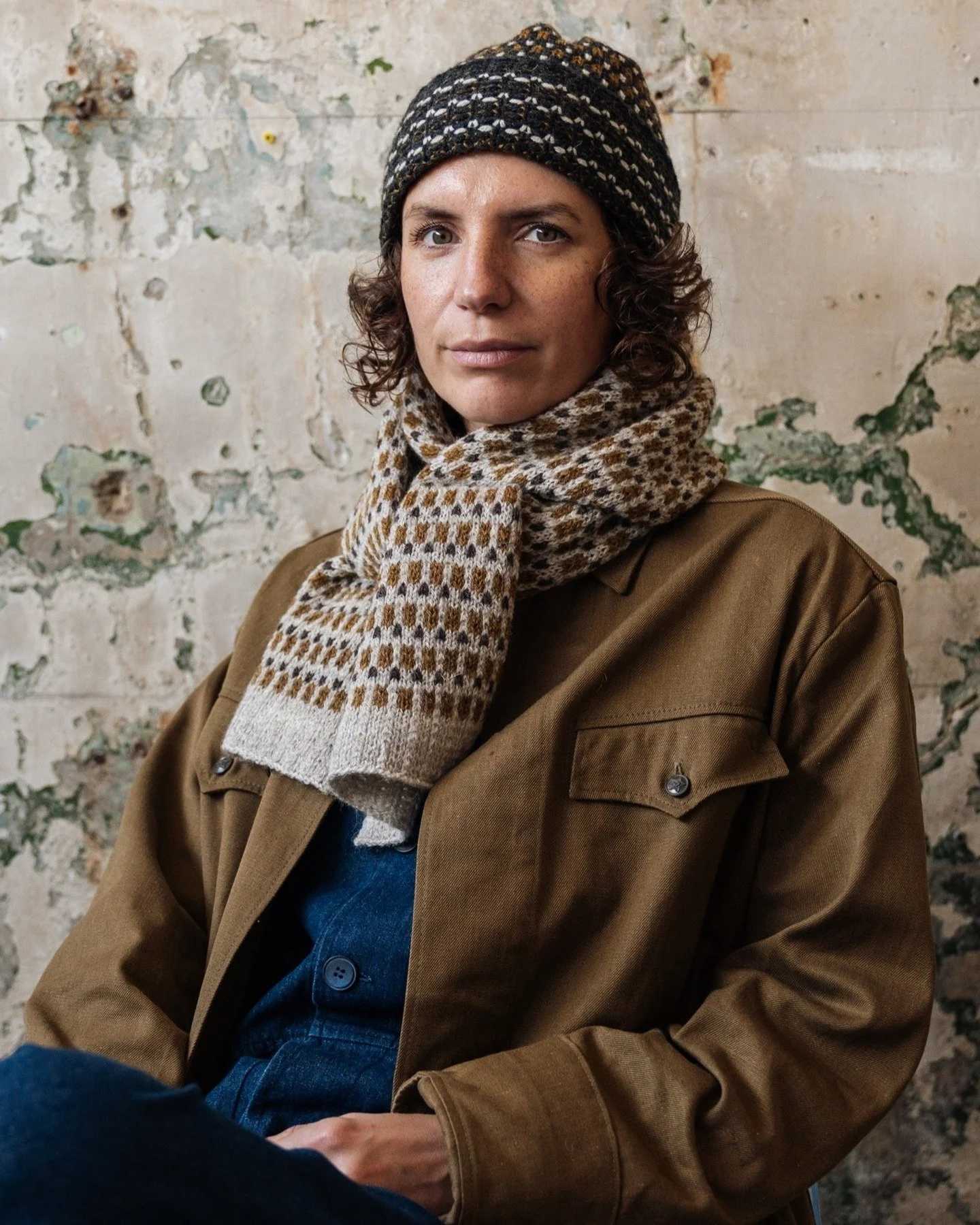 Amina wears the Honeycomb Scarf, crafted using beautiful British Wool, spun and dyed in Yorkshire, gathered from flocks of locally reared rare breed Blue Faced Leicester and Masham sheep. 

October is wool month and a reminder to celebrate this amazi