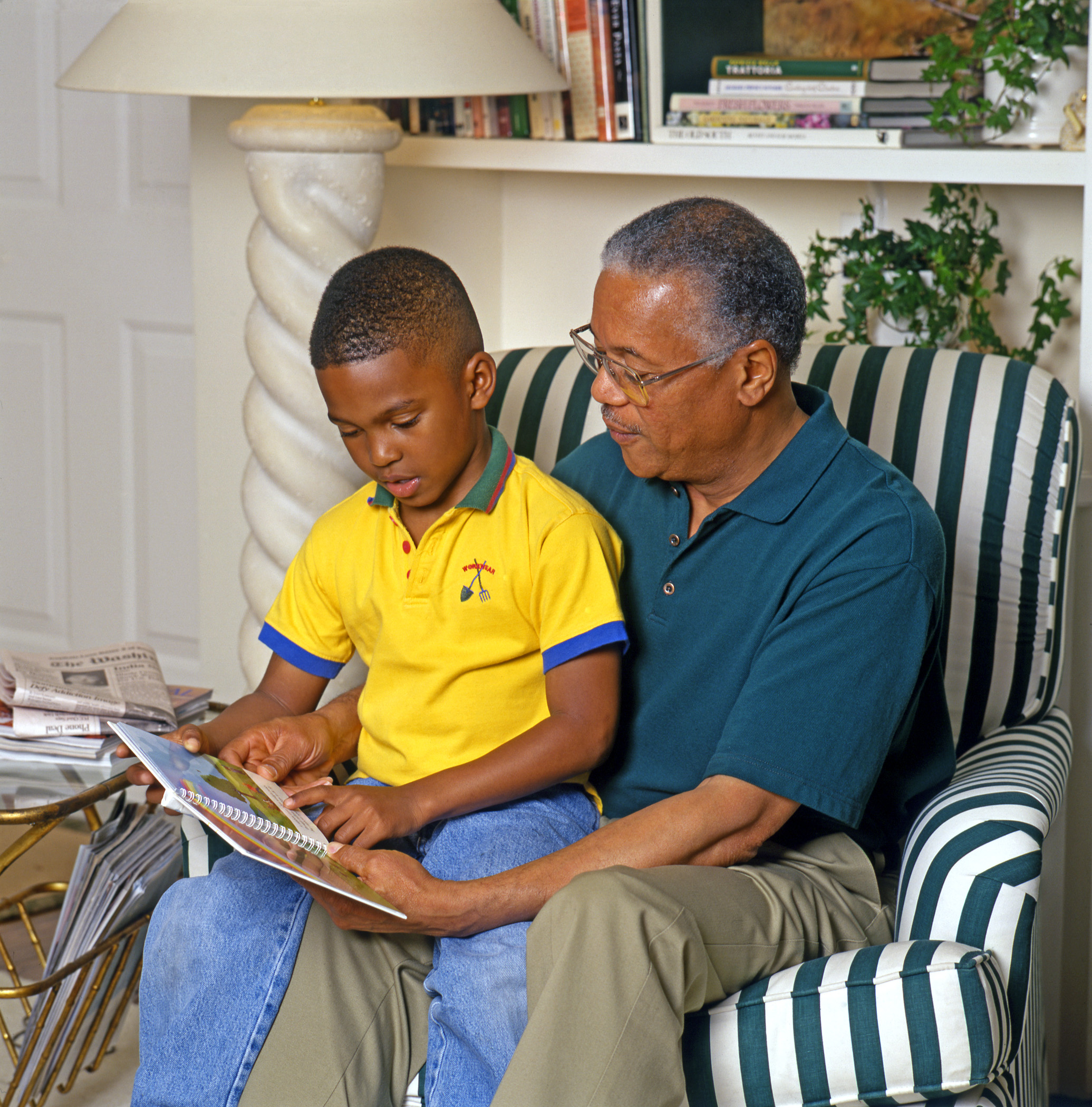 Grandpa Reading to Boy for APCO Agency Health Brochure