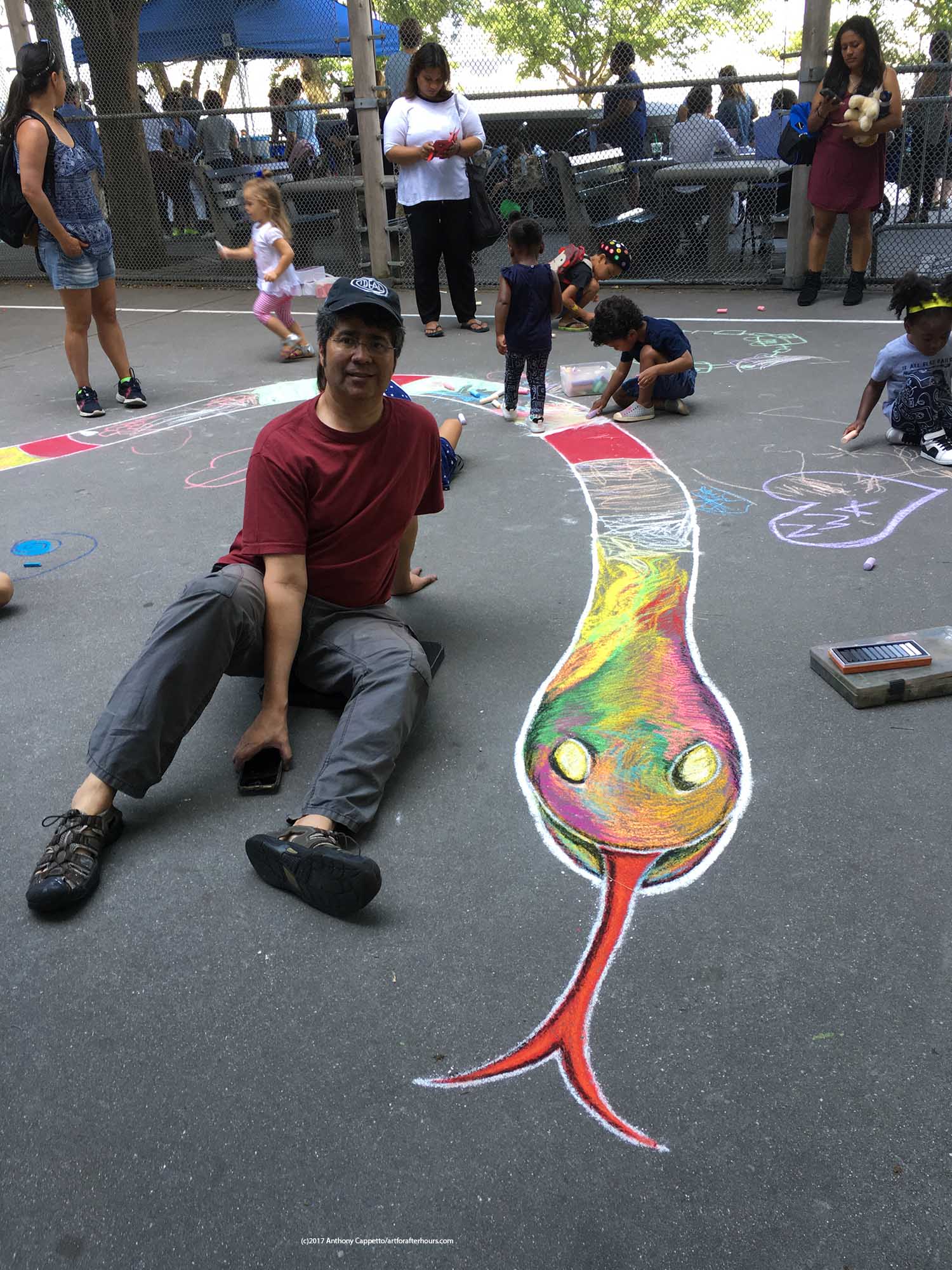 Anthony Cappetto posing for a picture with the head of the snake just before the kids descended upon the pavement which of course was the purpose of the pavement portion for this project! 
