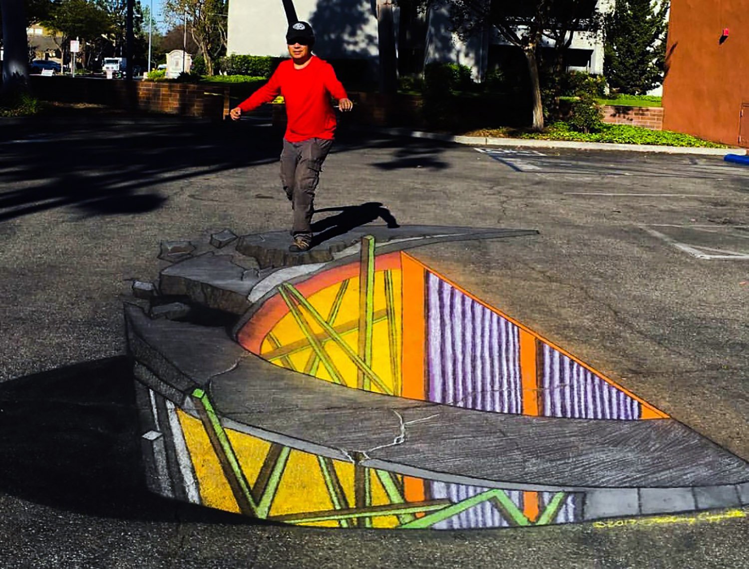 Watch How This Chalk Artist Creates Illusions on Pavement