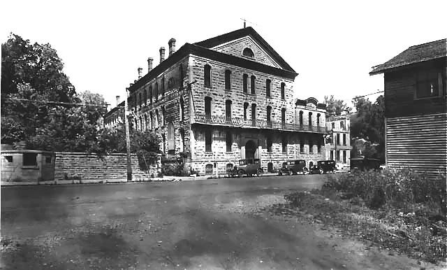 This is a view of the Territorial Prison site in 1936. The prisoners were relocated to the new facility south of Stillwater at this time. The buildings were used for manufacturing businesses.