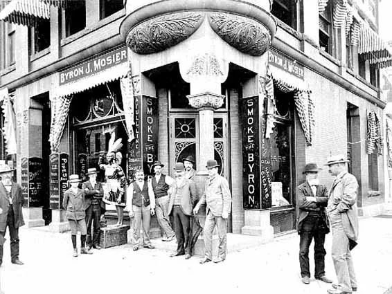 This is the Byron J Mosier Building on the NE corner of Chestnut and Main Street. The building was a tobacco shop in the earliest days. It was also a bakery. Presently it is Leo's Malt Shop, another favorite place to enjoy a lively, good and quick meal. Photo credit, Mr. John Runk, courtesy of the Stillwater Public Library. The tobacco shop was famous for the wooden cigar store icon, which now resides in the Minnesota History Museum. For a "Time-Tunnel" experience from the turn of the century to the year 2016, just Click or Tap on the above photo.