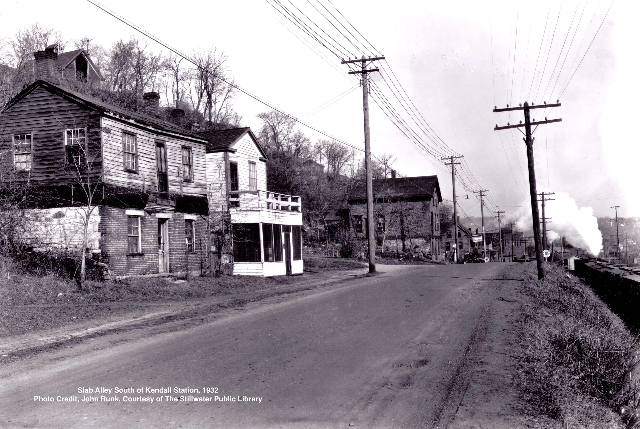 This photo was taken at a location about 1/4 mile south of the Crabtree Kendall Service Station. The year was 1932. The view is toward the north. All of these buildings were razed and these photos are all that remain of this busy area.