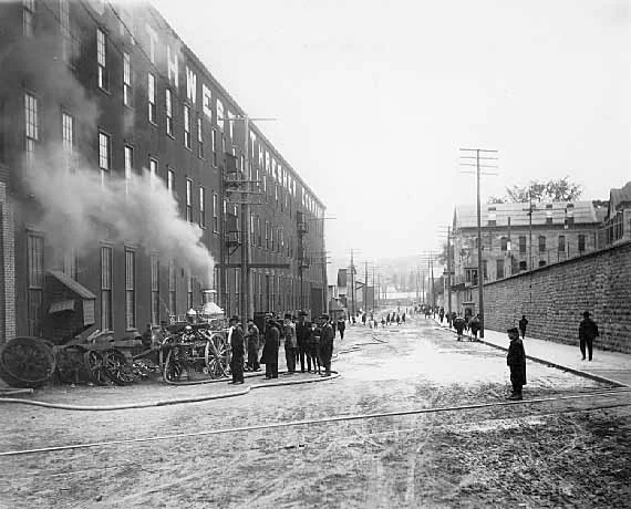 Fire at Northwest Thresher Company in 1909. The view is south on Main Street between the prison and the factory. Photo credit, Mr. John Runk, courtesy of the Stillwater Public Library.