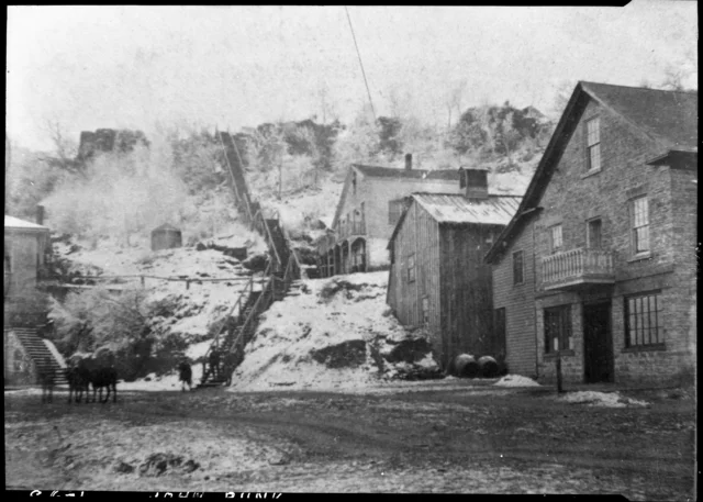 Another early view of the wooden stairs, this time with an additional series of stairs at the bottom. This photo is sourced from the John Runk Collection, courtesy of the Stillwater Public Library.