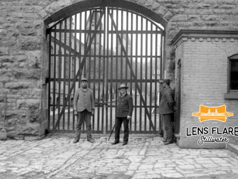 The Year is 1907 and this same location is now Terra Springs Condominiums. The architect designed the new towers to be located where the original towers were when it was the Territorial Prison. The two prisoners in the historic photo are trustees, while the armed guard keeps a close watch on everything outside the prison walls. This animation shows the overlap of the same location between 1907 and 2017. The historic photo is from the John Runk Collection courtesy of the Stillwater Public Library.