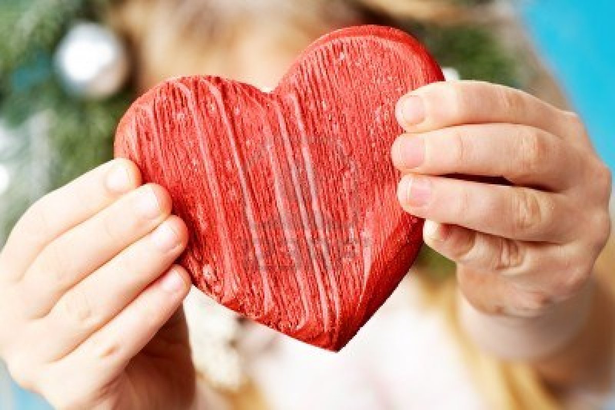 9360310-close-up-of-red-wooden-heart-in-child-s-hands-showing-it.jpg