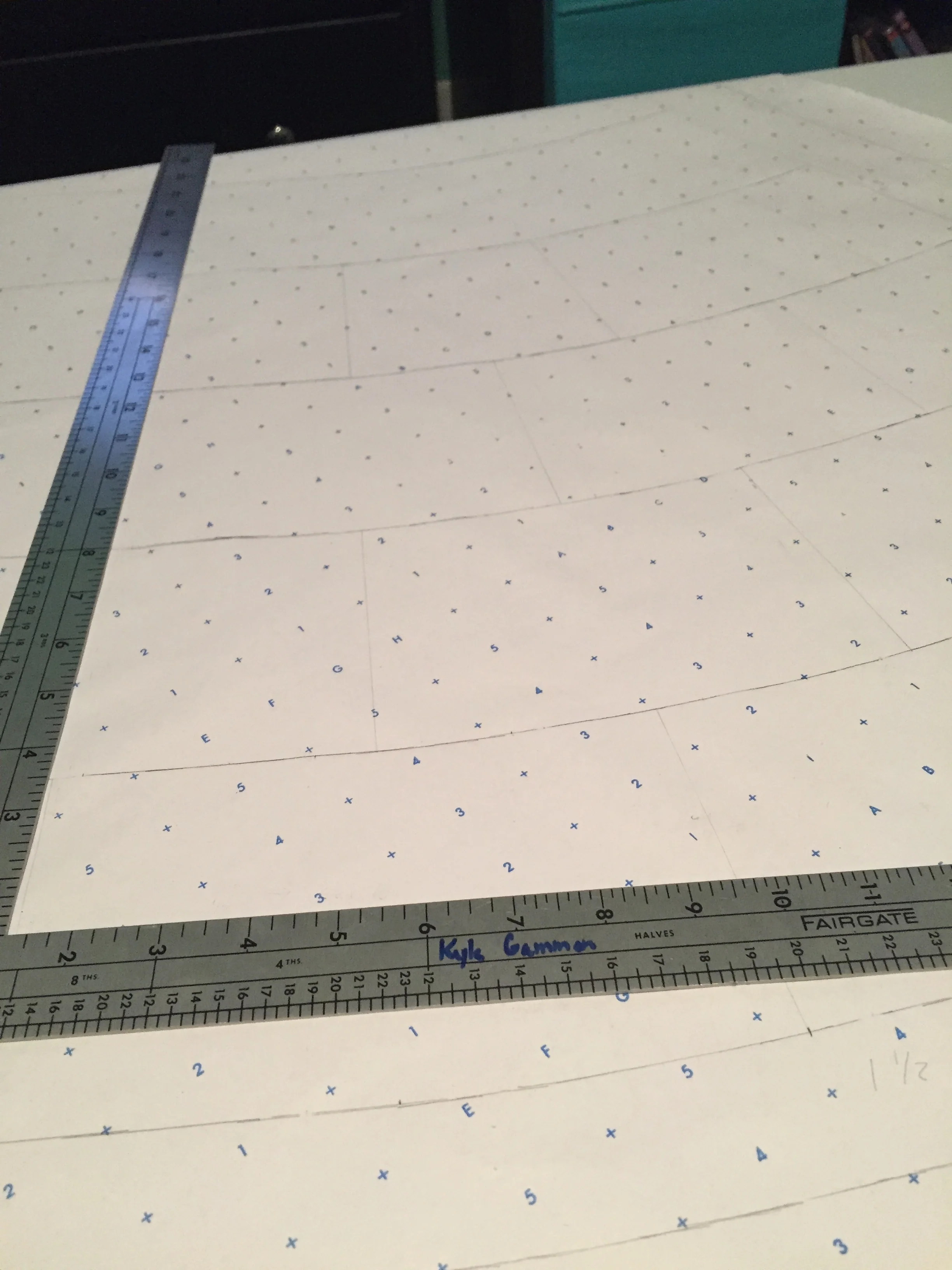  Pattern drafting the coat, which required precision and planning to fit together all the patchwork pieces correctly. 