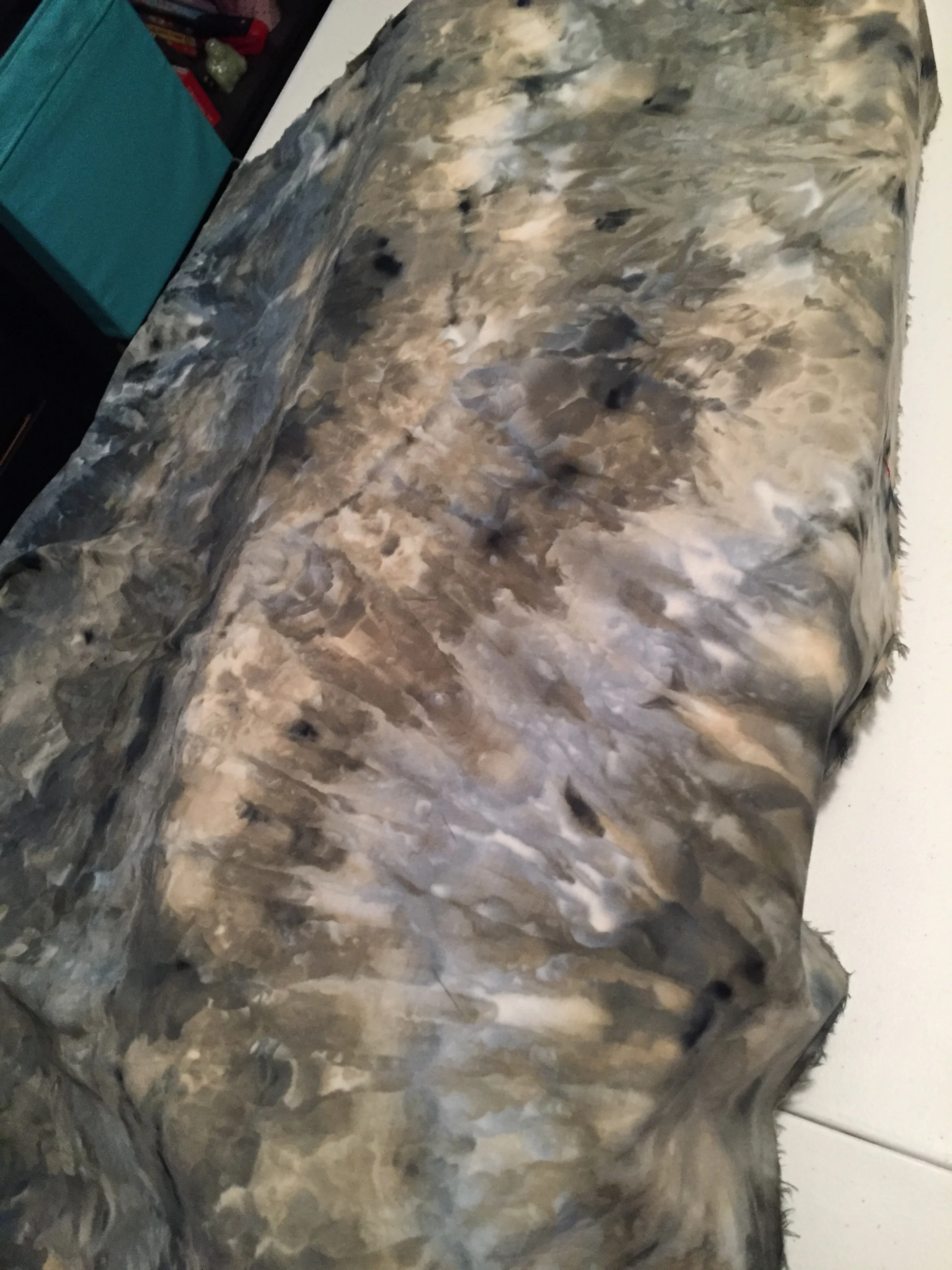  Ice dyeing was used in several pieces by placing ice on top of fabric and then sprinkling powdered dye onto that, allowing the dye to seep into the fabric. 