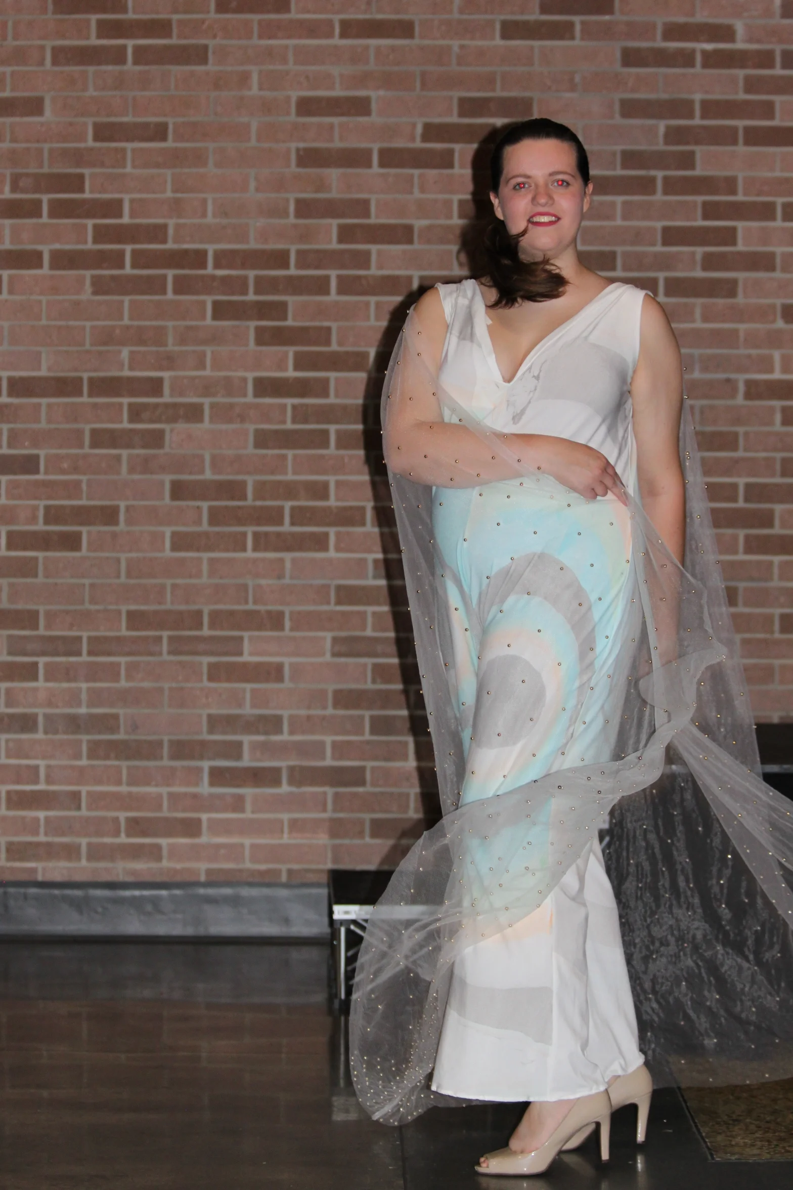  I used another plus-size female model for this look, which required padding out a dressform in the school’s sewing lab and meeting for multiple fittings due to the stretch material. The look was completed with nude high heels, make-up, a black handh