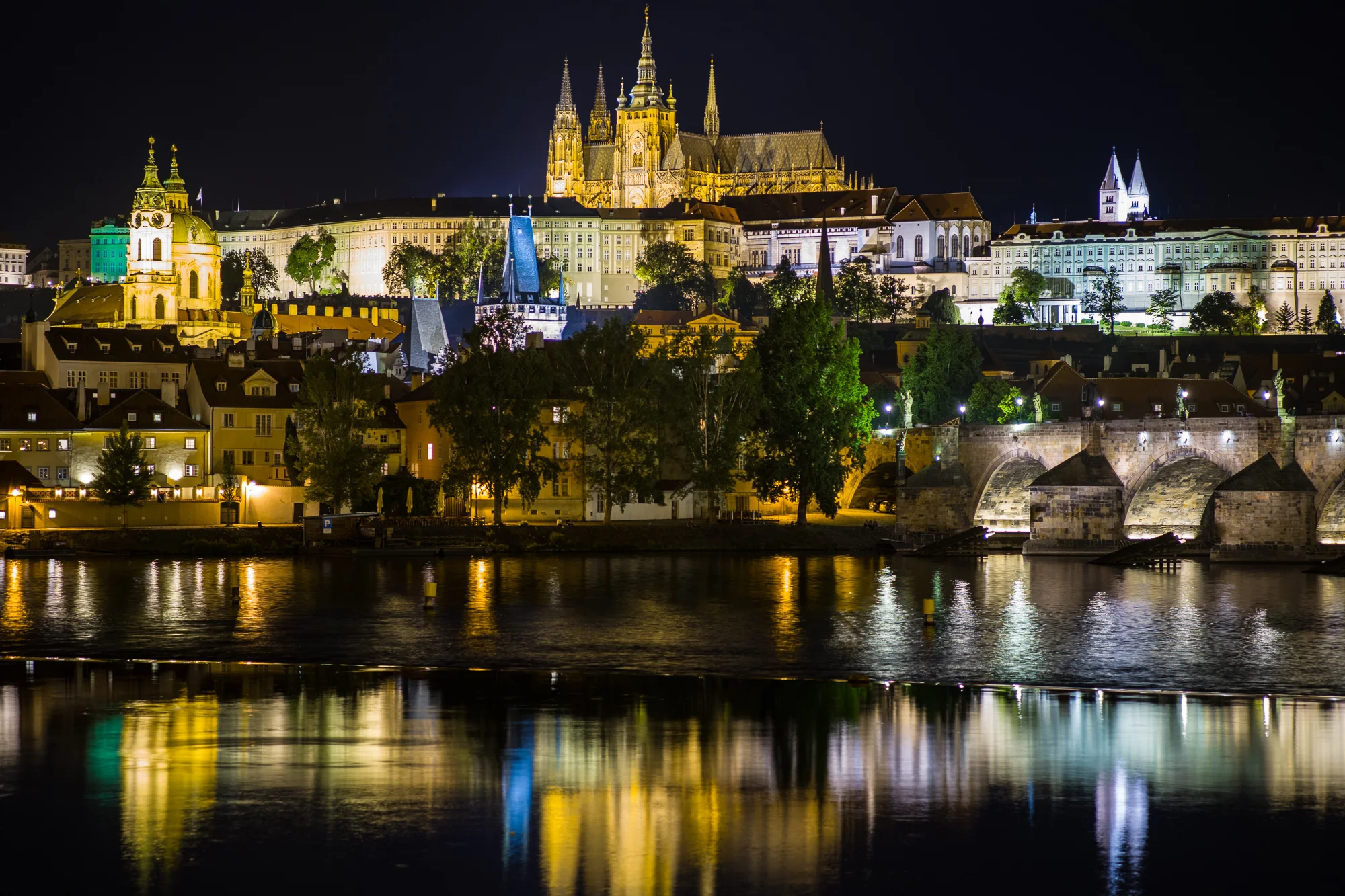 View of Prague Castle and Charles Bridge above the Vltava River. Photo taken from the Bellevue Restaurant Terrace.