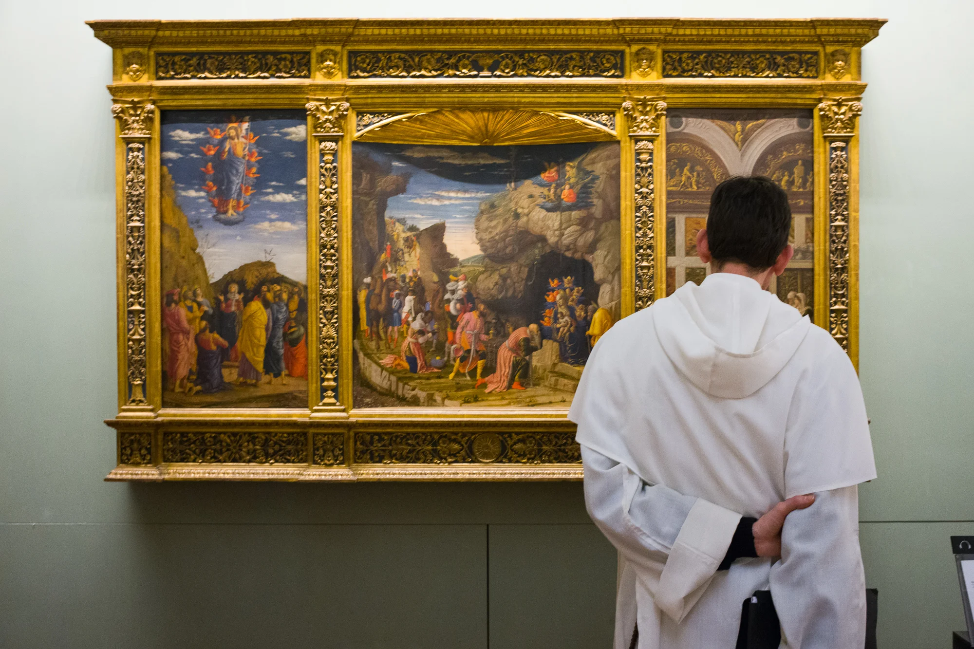 A priest enjoying sacred art at The Uffizi