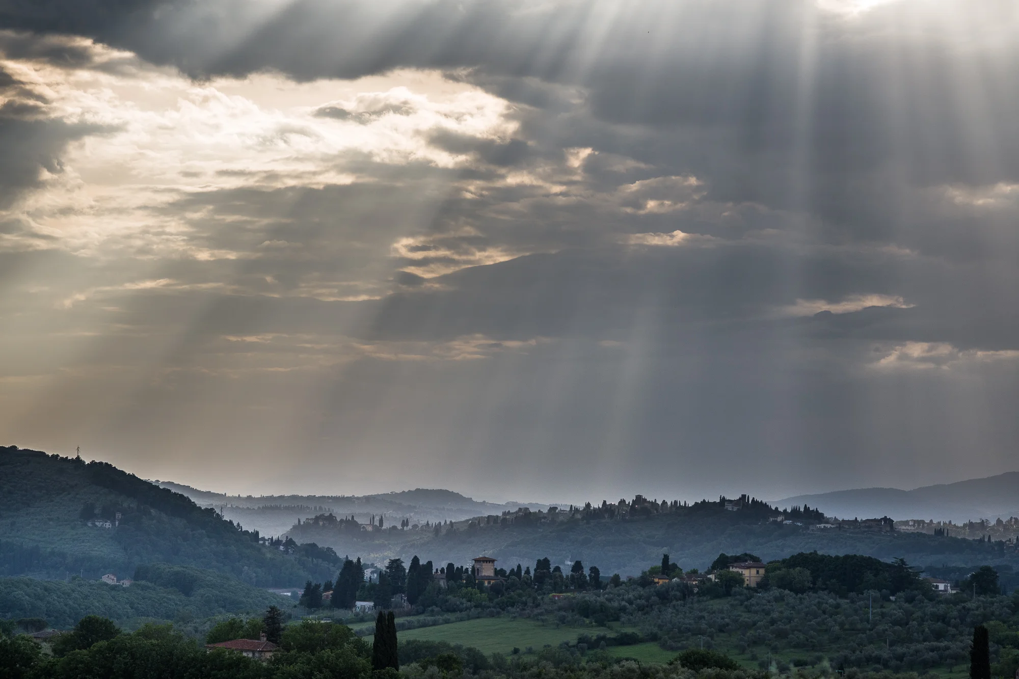 Tuscan hills with sun rays